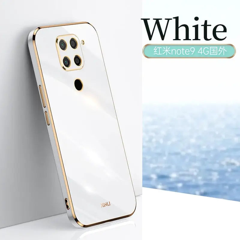 a white and gold phone with a white background