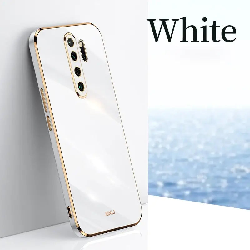 a white and gold phone with the text white