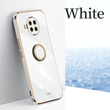 a white phone with a gold ring on it