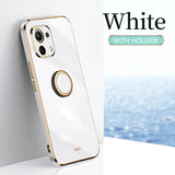 A white and gold iphone case with a white background