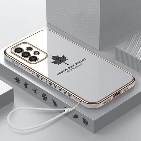 a white and gold iphone case with a star design