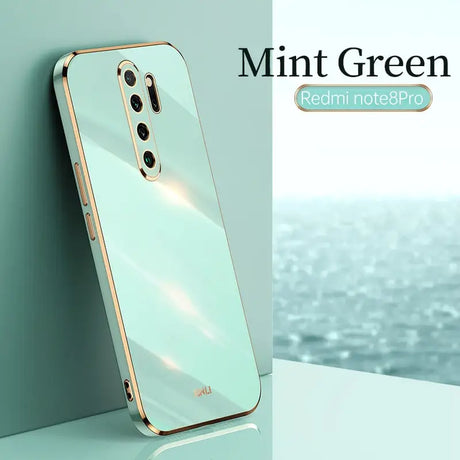 the mint green iphone case is shown on a white surface