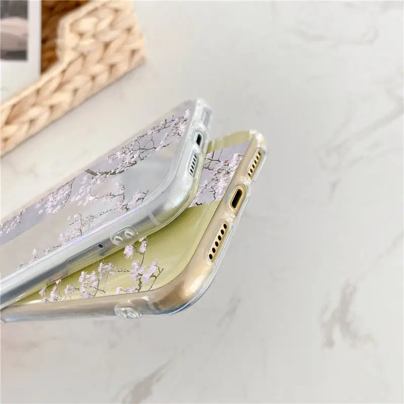 a phone case with a white flower design