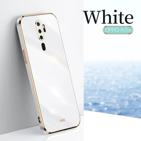 A white and gold iphone with the white op logo on it