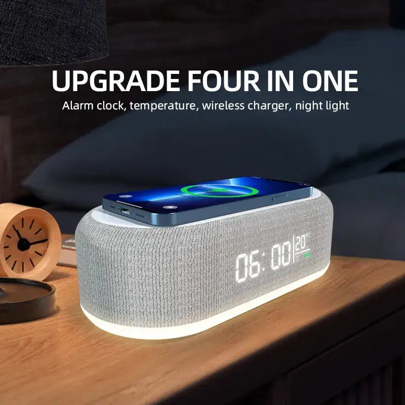 A white and gray speaker sitting on top of a wooden table