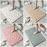 the bath mat is made from foam and has a pattern of circles