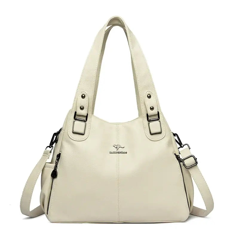 a white handbag with a zipper closure