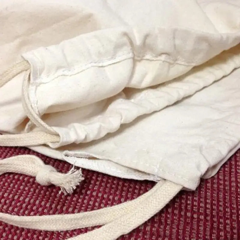 a white bag with a zipper on it