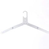 a white hanger on a white background