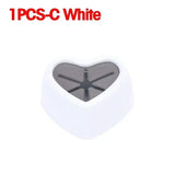 a white heart shaped object with a black heart