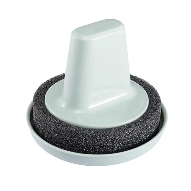 a white cup with a black sponge on top