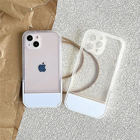 A white iphone case sitting on top of a brown paper