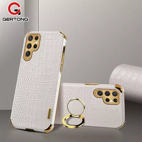 a white iphone case with a gold ring