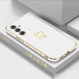 a white iphone case with gold hearts on it