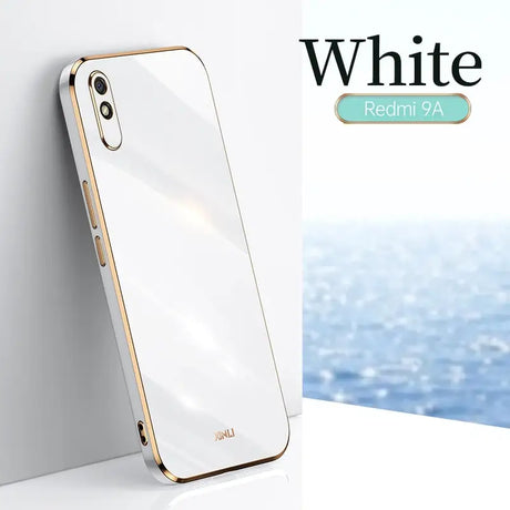 A white iphone case with a gold rim