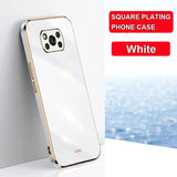 a white phone with a gold frame and a white background