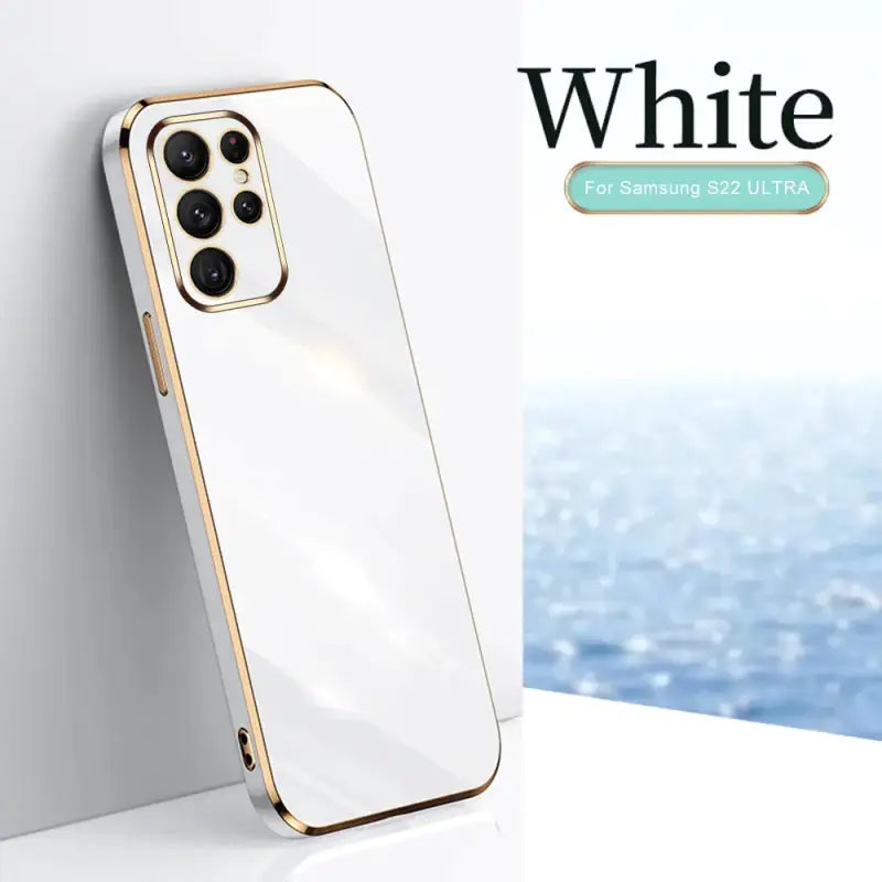 a white iphone case with a gold rim