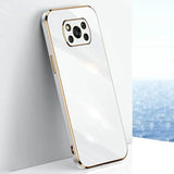 the back of a white iphone case with gold trim