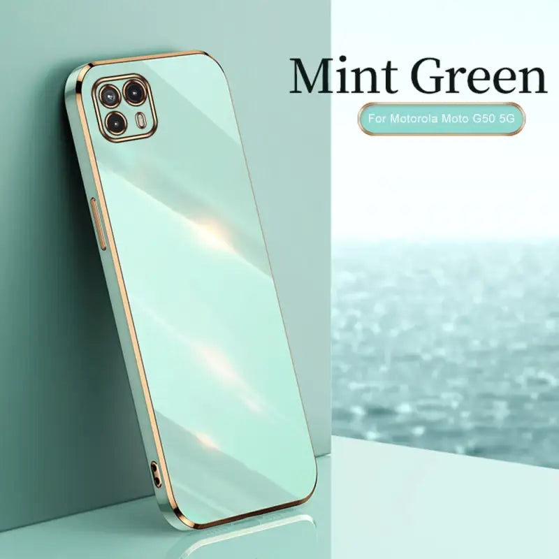 the mint green iphone case is shown on a white surface