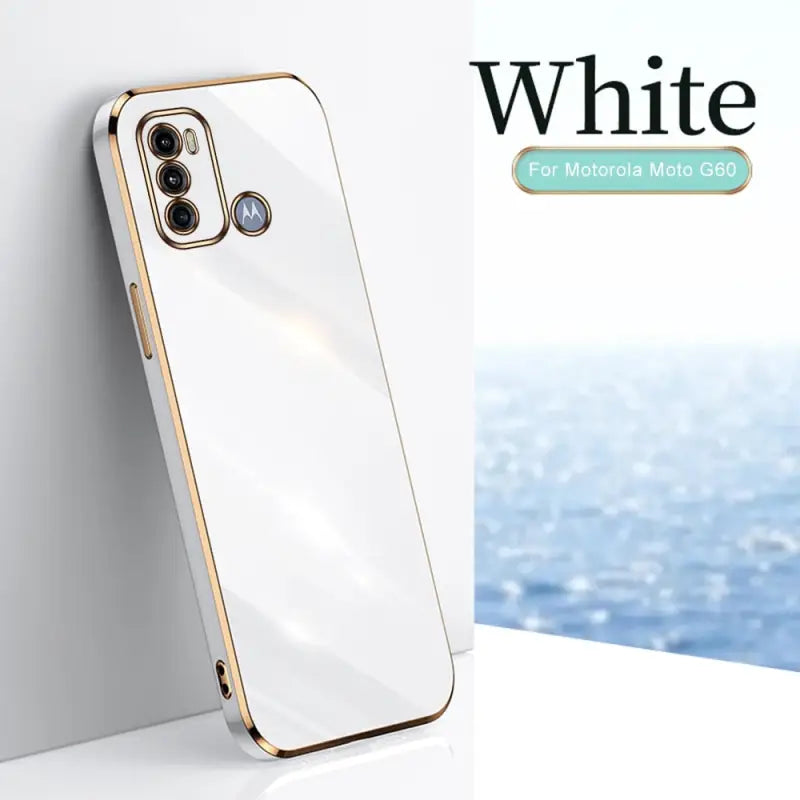 a white and gold iphone case with the white logo