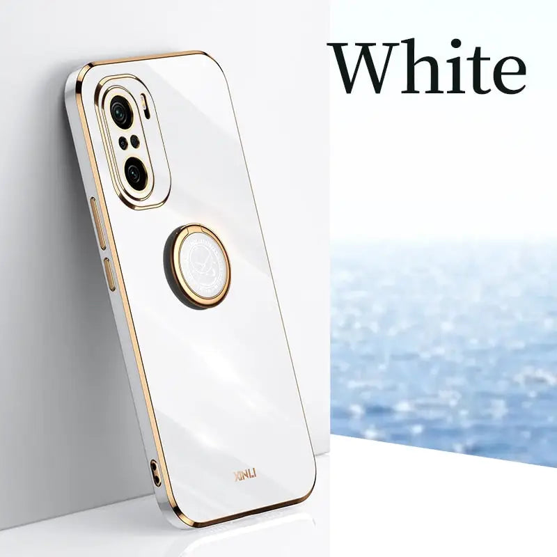 a white iphone case with a gold ring