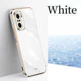 a white iphone case with a gold rim