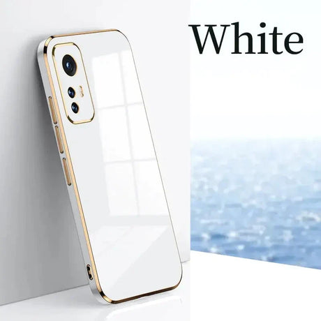 a white iphone case with a gold rim