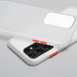 the back of a white iphone case with a red light on it