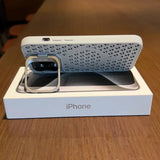 White iPhone case with a perforated pattern and a square camera cutout.