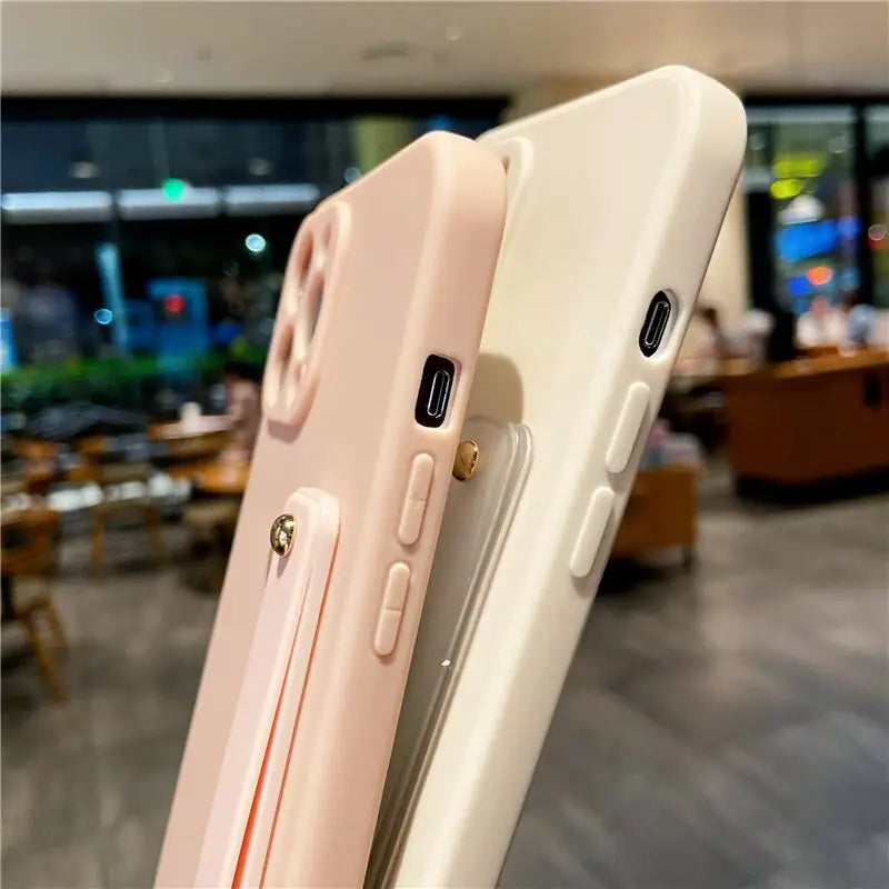 the back of a white iphone case with a pink and white phone