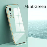 a white iphone case sitting on top of a table