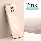 the back of a gold iphone with a white background