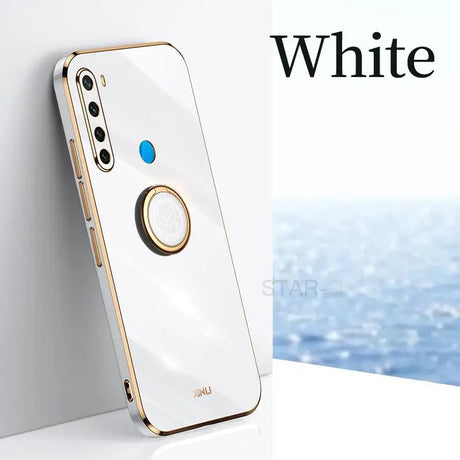 a white iphone with a gold ring on it