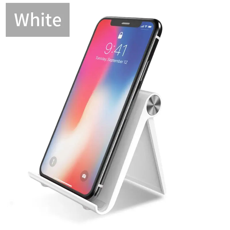 the white iphone x stand with a white phone in the background