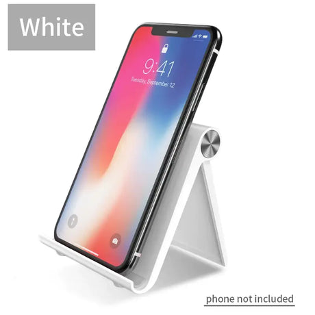 The white iphone stand with a phone in it