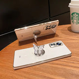 a white iphone on a table