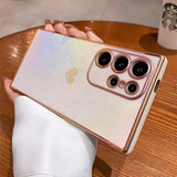 A white iridescent smartphone case with a gold frame and camera cutout, featuring a subtle gold heart pattern.