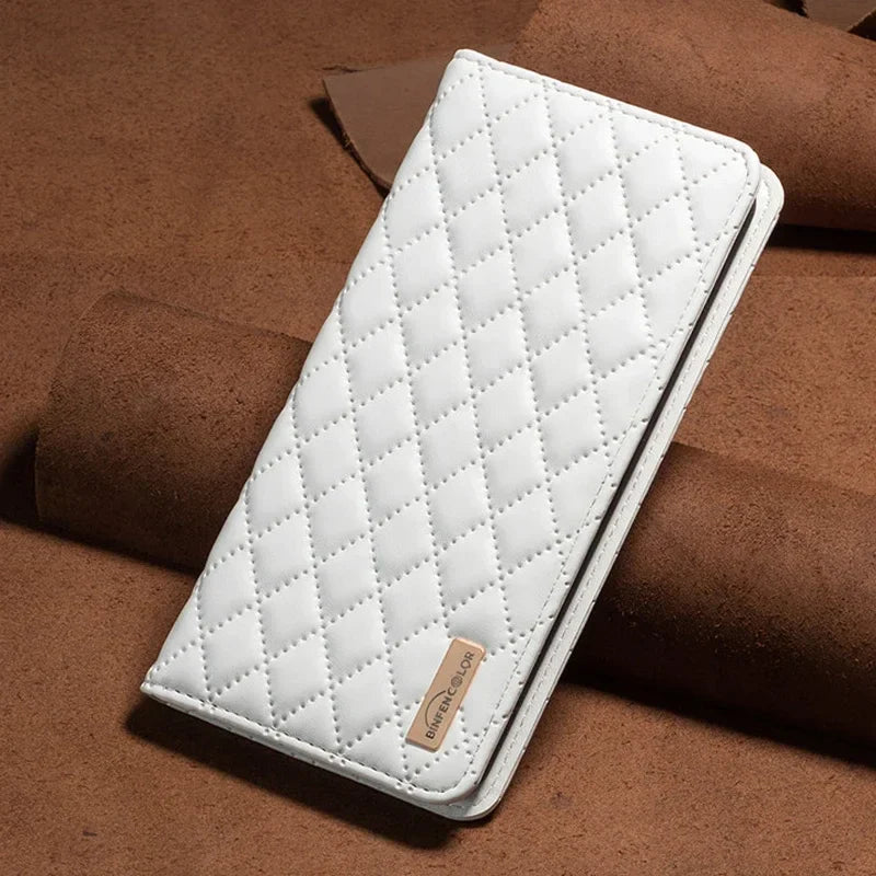 the white leather iphone case is laying on a brick