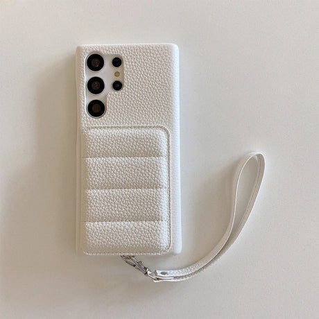 White leather smartphone case with a card holder and wrist strap.