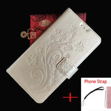 a white leather wallet with a red and white floral design