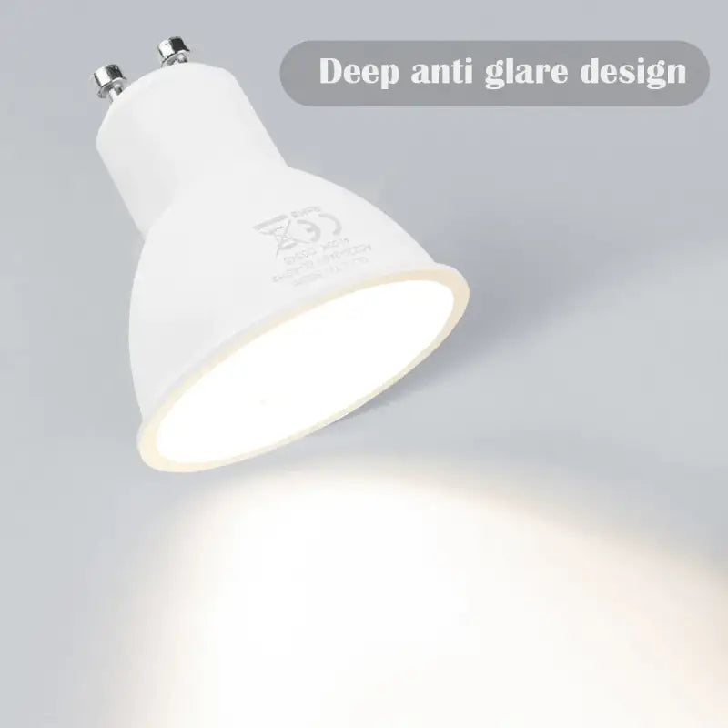 a white light bulb on a gray background