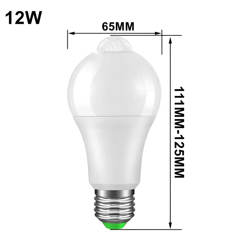 A white light bulb with a green light on it