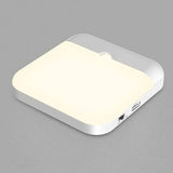 A white light on a gray surface