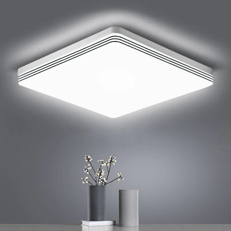 a white ceiling light with a white square shape
