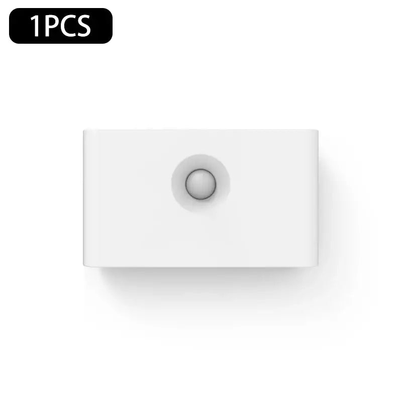 a white light switch with a white button