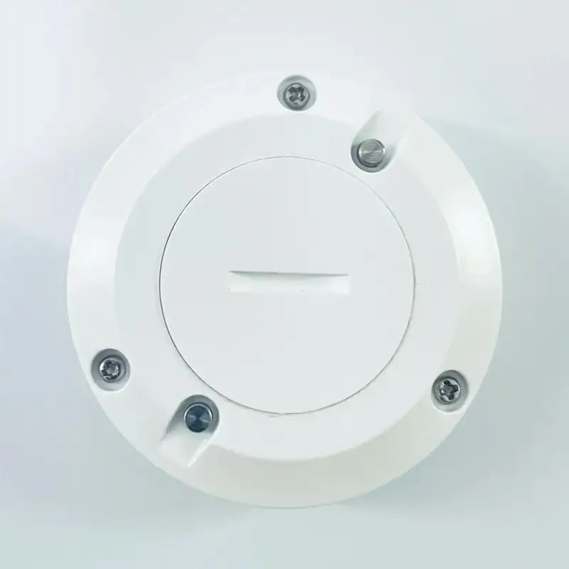 a white light switch with two screws