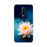 a white lotus flower on a blue background phone case