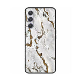 a white marble phone case with gold foil detailing