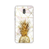 a gold pineapple on a marble background