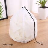 a white bag with a string on it